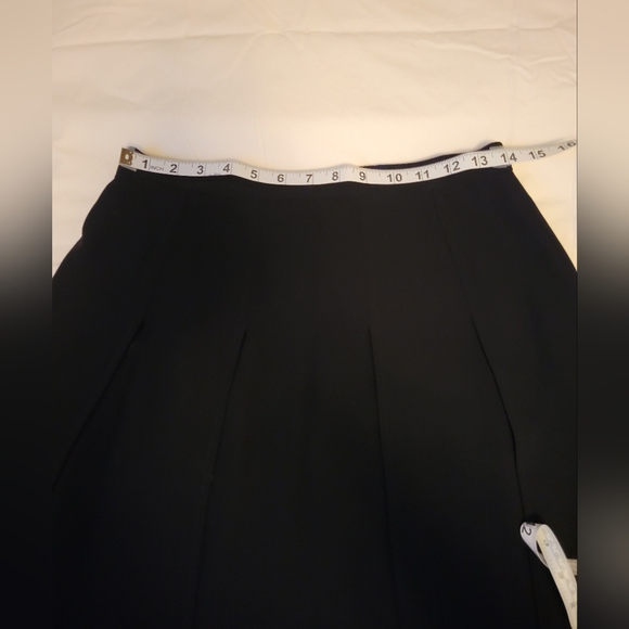 CHANEL Black Asymmetrical Pleated Midi Skirt – Boutique – Size FR 42 (US 10) - Picture 12 of 12